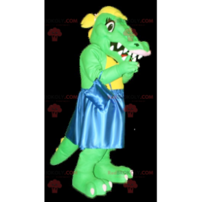 Mascote crocodilo verde e amarelo com vestido azul -