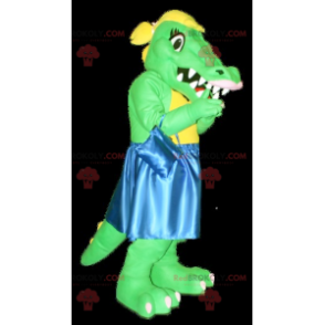 Mascotte coccodrillo verde e giallo con un vestito blu -
