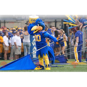 Blue and yellow bird mascot in sportswear - Redbrokoly.com