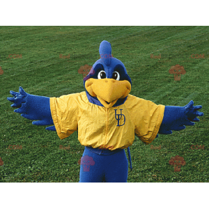 Mascota pájaro azul y amarillo en ropa deportiva -