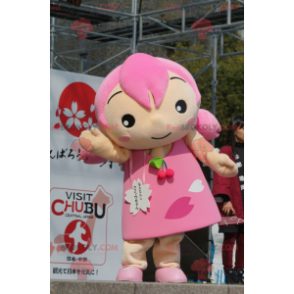 Mascota de niña con cabello y un vestido rosa - Redbrokoly.com