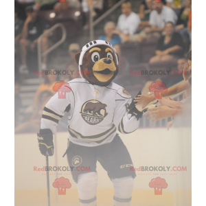 Mascotte d'ours marron en tenue de hockey