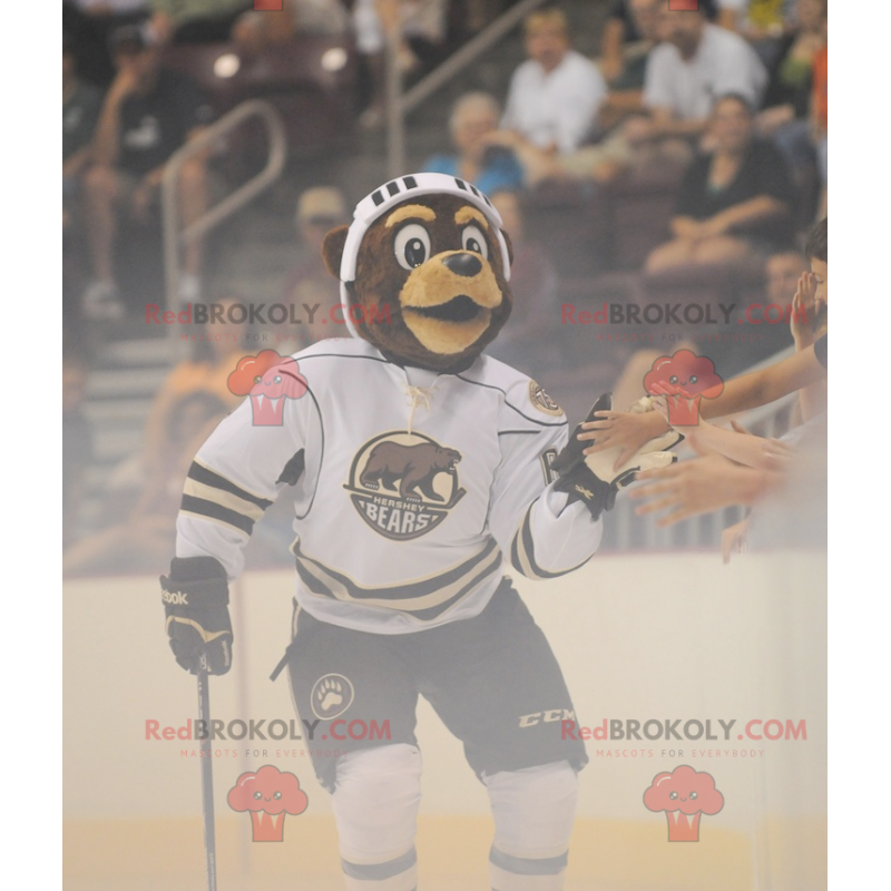 Mascotte dell'orso bruno in attrezzatura da hockey -