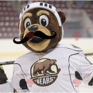 Mascotte dell'orso bruno in attrezzatura da hockey -