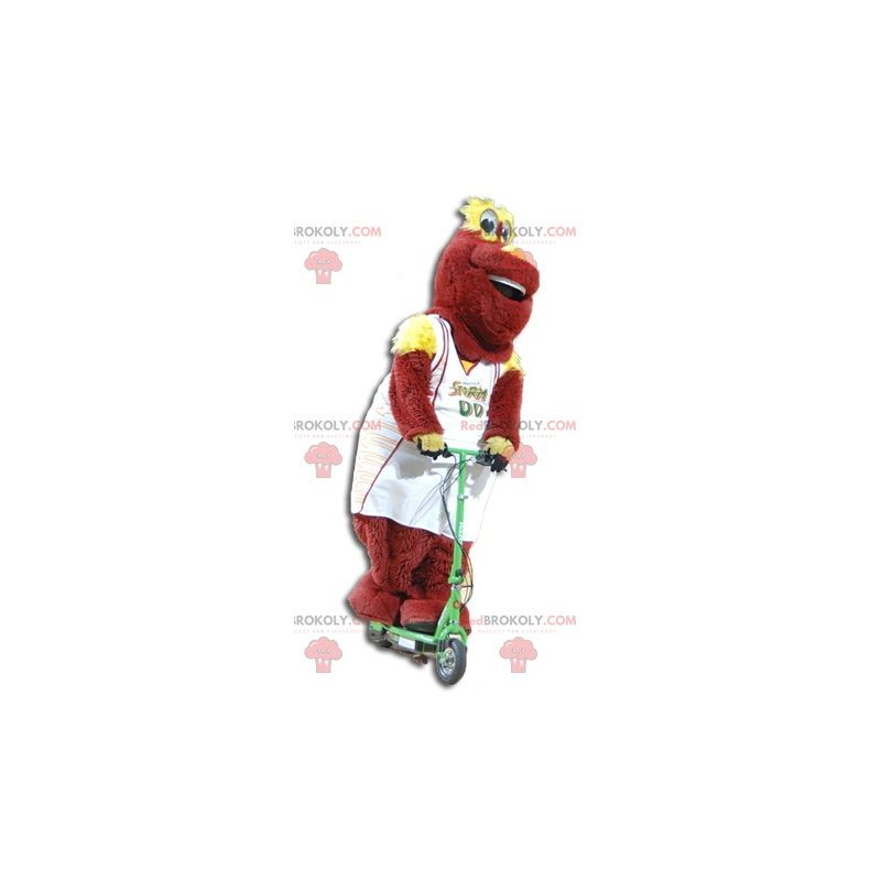 Rotes und gelbes Plüschmaskottchen in Sportbekleidung - Rotes und gelbes Plüschmaskottchen in Sportbekleidung -