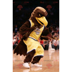 Brown eagle mascot dressed in yellow sportswear - Redbrokoly.com