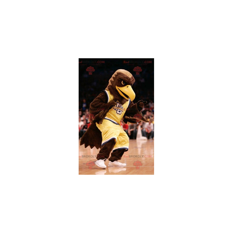 Brown eagle mascot dressed in yellow sportswear - Redbrokoly.com