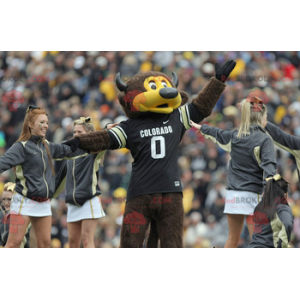 Mascotte d'ours marron et jaune avec des cornes et un maillot -