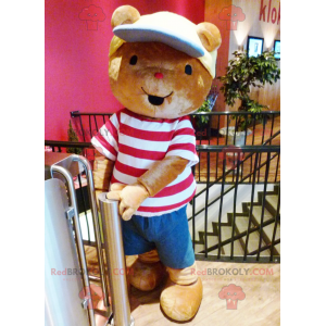 Brown teddy bear mascot with a t-shirt and a cap -