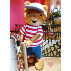 Brown teddy bear mascot with a t-shirt and a cap -