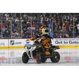 Black and white yellow tiger mascot dressed in a black costume