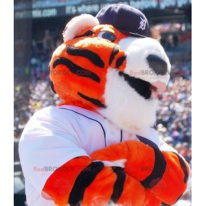 Mascotte de tigre orange blanc et noir en tenue de sport -