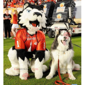 Mascotte de chien blanc et noir avec des yeux bleus -