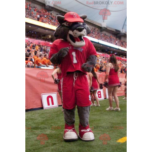 Mascote de lobo cinzento em roupa esportiva vermelha -