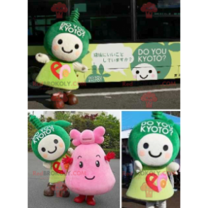 2 Maskottchen mit grünen und rosa Manga-Charakteren -