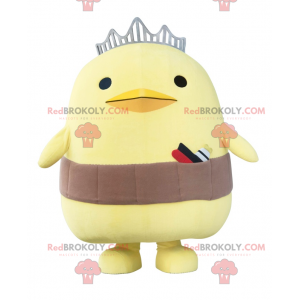 Stor gul kycklingmaskot med en krona och ett bälte -
