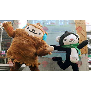 2 mascots a brown yeti and a black and white monkey -
