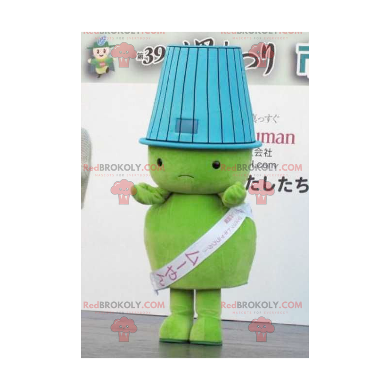 Mascotte grote groene man met een lampenkap op zijn hoofd -