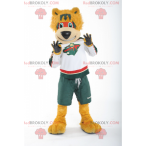 Mascote urso laranja em roupas esportivas - Redbrokoly.com