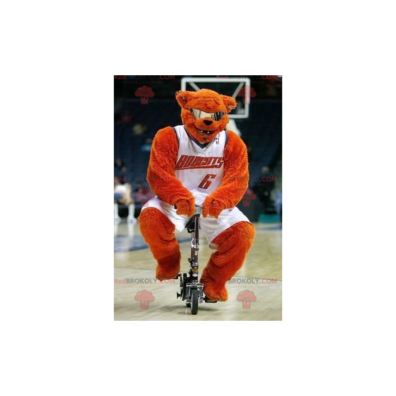 Orange bear mascot with glasses in basketball outfit -