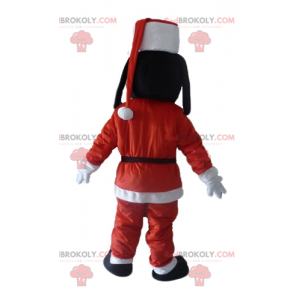 Goofy mascot Mickey's friend in Santa Claus outfit -