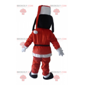 Goofy mascot Mickey's friend in Santa Claus outfit -