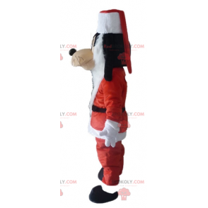 Goofy mascot Mickey's friend in Santa Claus outfit -