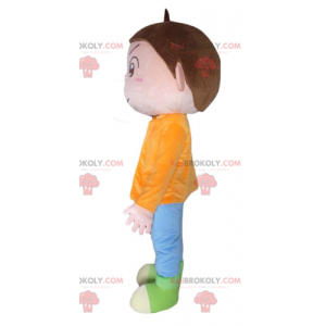 Brown boy mascot with an orange blue and green outfit -
