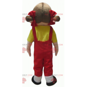 Mascot girl in red overalls with a yellow t-shirt -