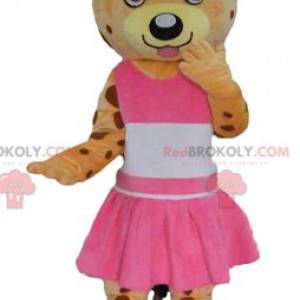 Orange nallebjörnmaskot och gul tiger klädd i rosa -