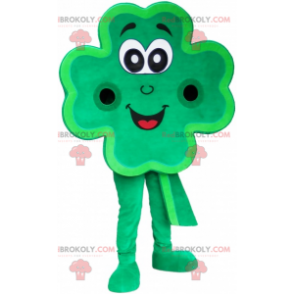 Mascote trevo gigante verde de 4 folhas sorrindo -