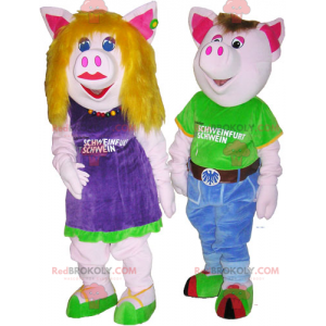 2 mascottes de cochons homme et femme en tenues colorées -