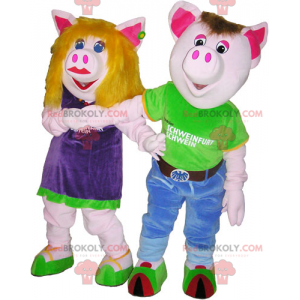 2 mascottes de cochons homme et femme en tenues colorées -