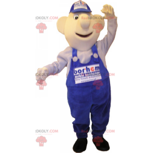 Mascotte de bonhomme en salopette et casquette bleues -