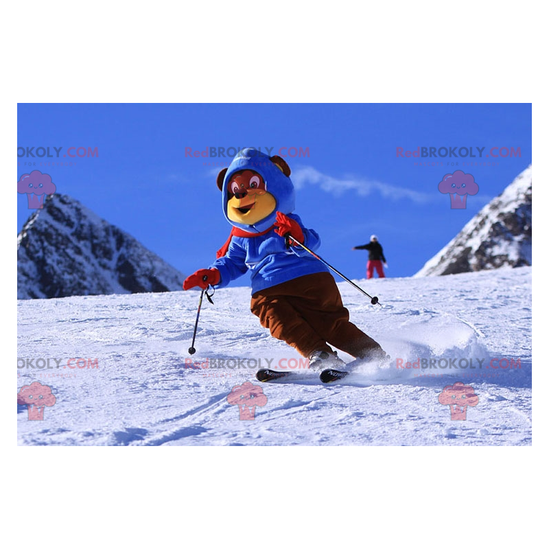 Brown and yellow bear mascot in ski outfit. Winter teddy bear -