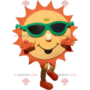 Mascotte de soleil jaune et orange avec des lunettes de soleil