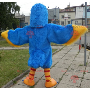 Blaues und gelbes Vogelmaskottchen. Adler Maskottchen -