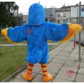 Blaues und gelbes Vogelmaskottchen. Adler Maskottchen -