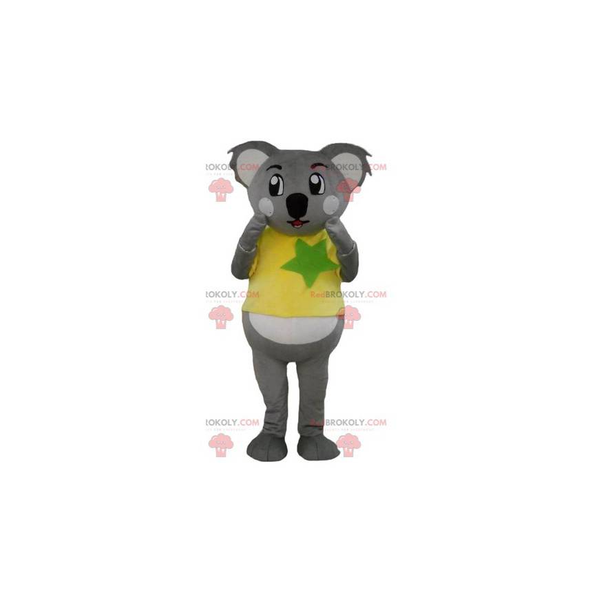 Gray and white koala mascot with a yellow and green t-shirt -