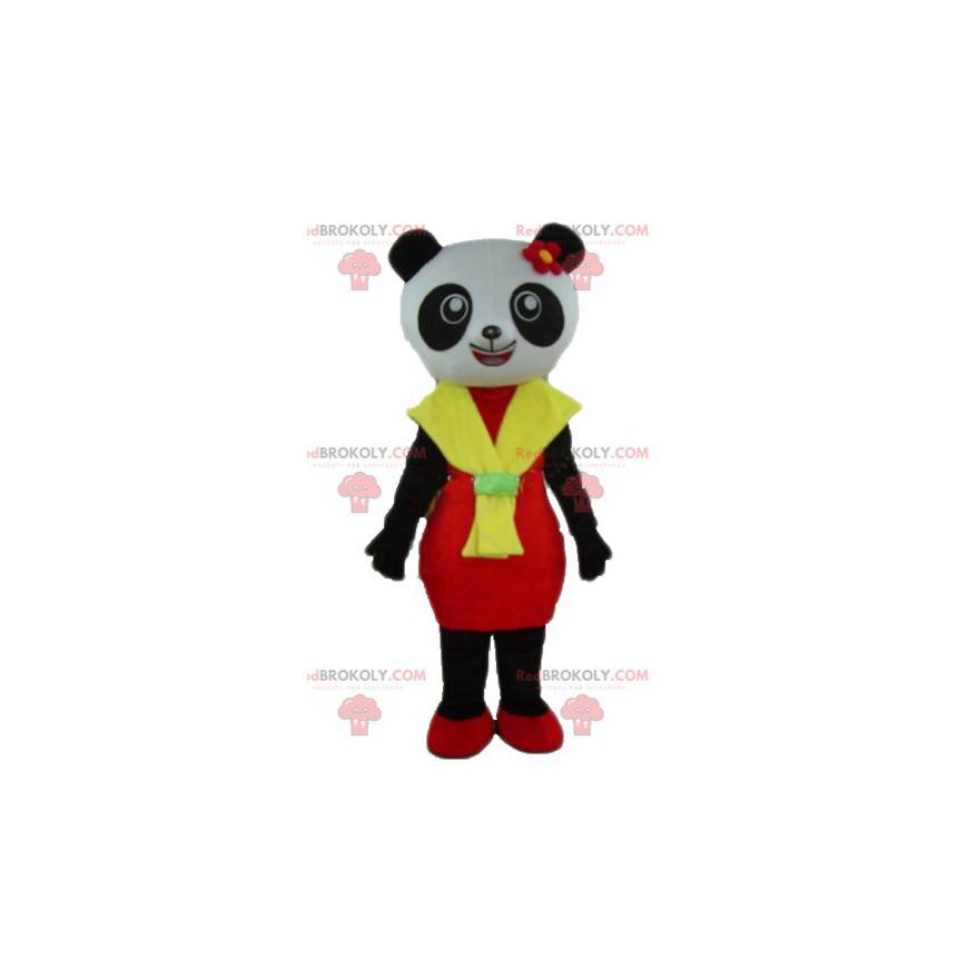 Mascote panda preto e branco com vestido vermelho e amarelo -