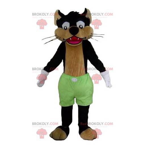 Zwarte en bruine wolfskatmascotte met groene korte broek -