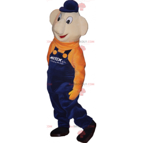 Mascota de muñeco de nieve con overol azul y suéter naranja -