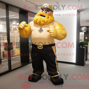 Gold Strongman maskot...