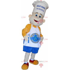 Cozinheiro mascote com um lindo chapéu de chef e um avental -