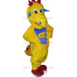 Żółta maskotka dinozaura z niebieskim brzuchem - Redbrokoly.com
