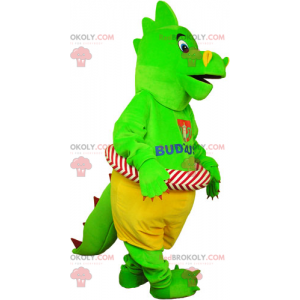 Grön dinosaurmaskot med sin boj - Redbrokoly.com