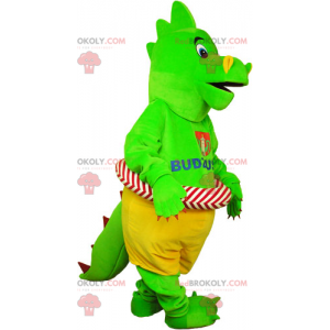 Mascota dinosaurio verde con su boya - Redbrokoly.com