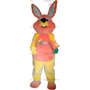 Mascotte de lapin orange et jaune avec une carotte -