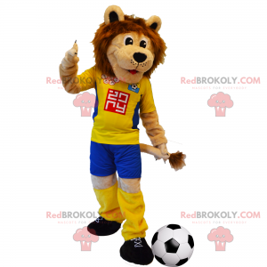 Mascota de león con traje de fútbol amarillo - Redbrokoly.com
