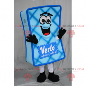 Mascotte de matelas bleu avec visage souriant - Redbrokoly.com